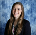 photo of student Jenna Wolf in front of a blue background