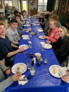 Students seated at dinner table