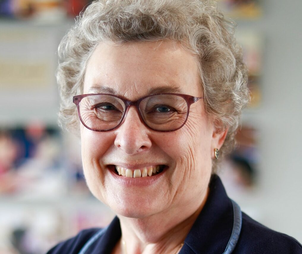 Deborah Corpus, smiling with glasses
