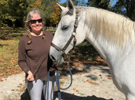 Angela Hofstetter with white horse