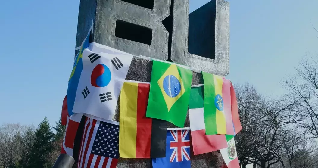 world flags on the BU sign