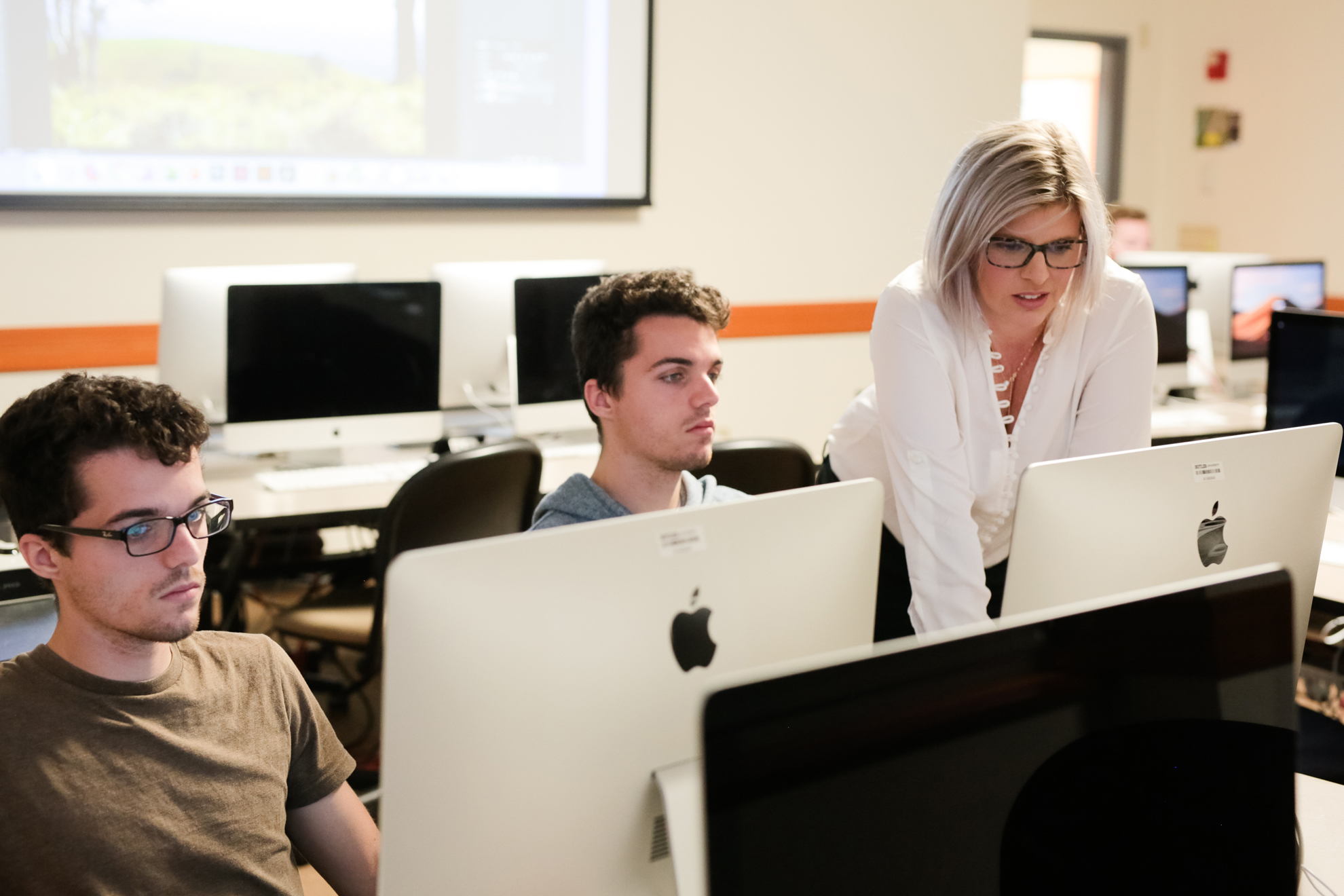Carrie Rector helping students on computers