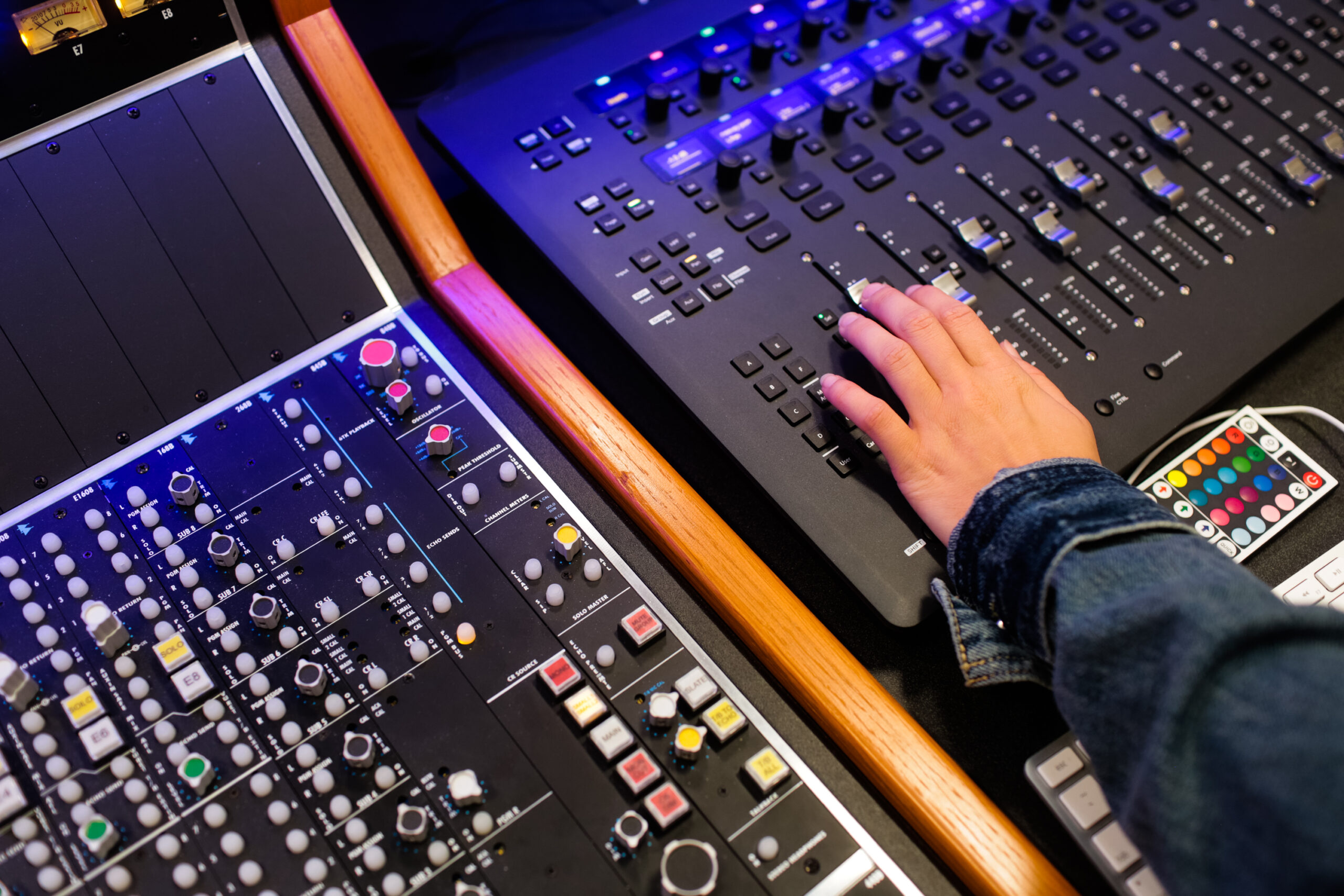 student's hand working on a sound board