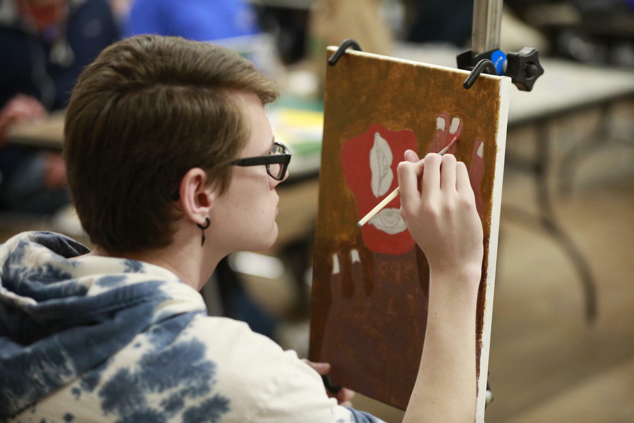 Student painting on a canvas