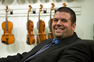 John Rihani, manager of Encore Orchestral Strings