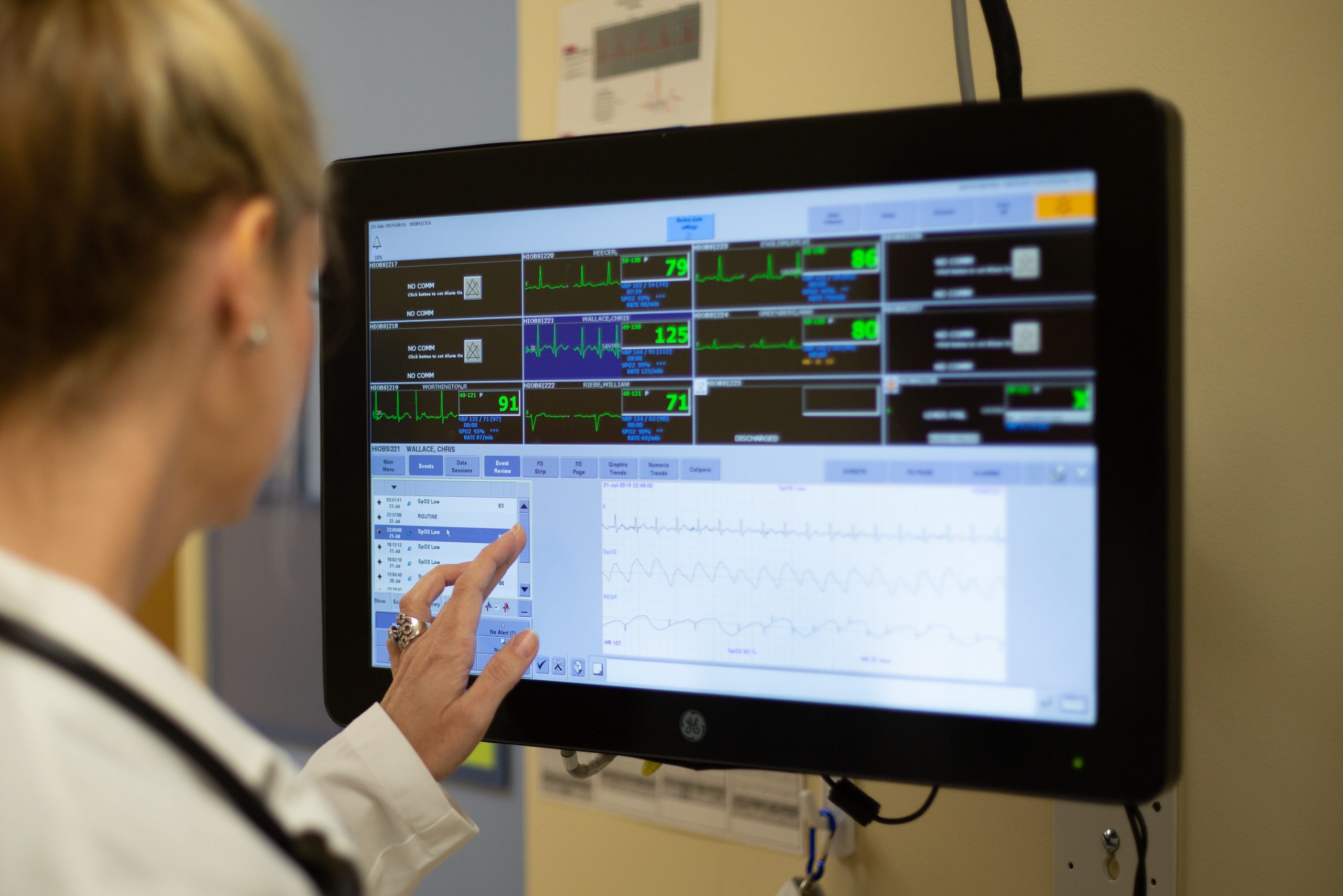 female student looking at vitals on a screen