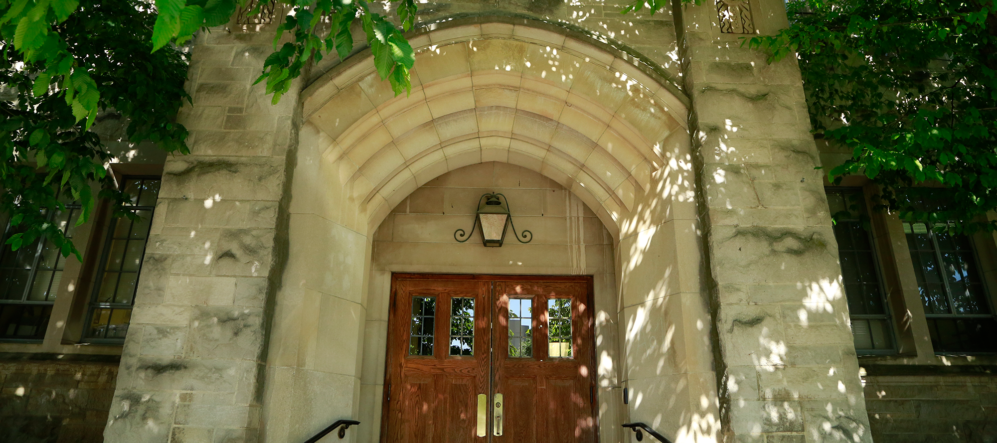 Pharmacy Building arched entrance of limestone and brown doors