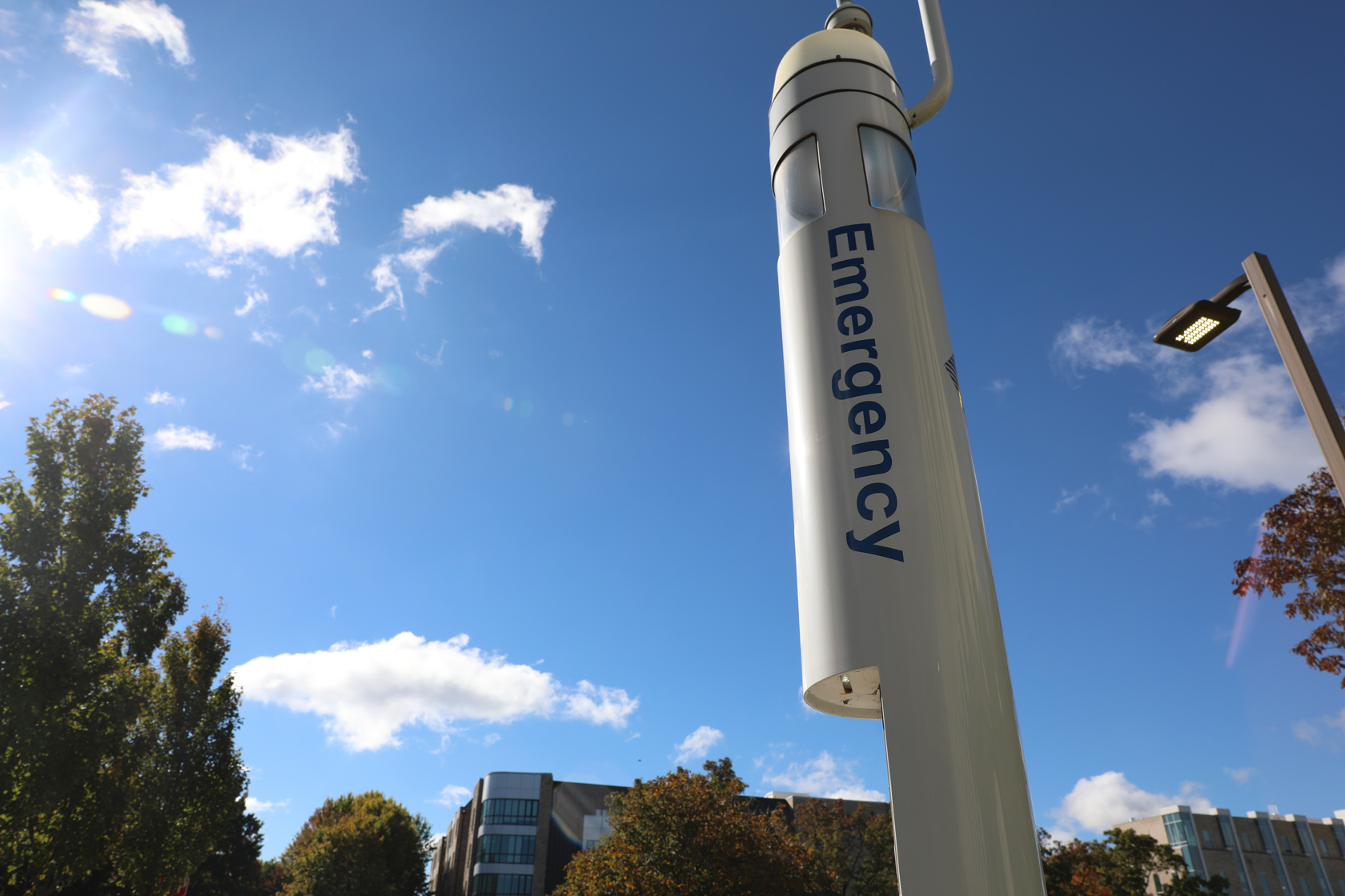 white emergency pole on campus