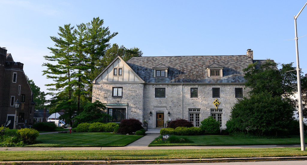 Kappa Alpha Theta house, beige brick, three levels, grassy lawn