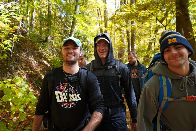 Members walking in woods