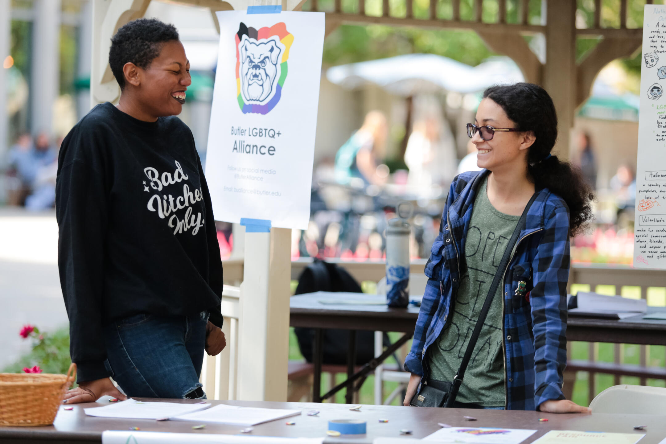two students at a table for the Butler LGBTQ+ Alliance club on campus