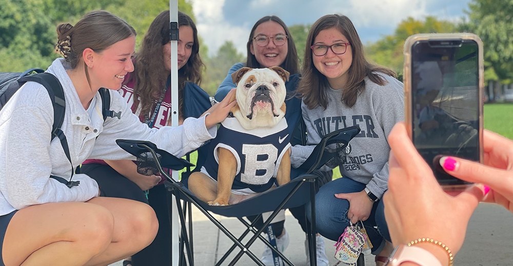 Butler Blue with students getting photographed