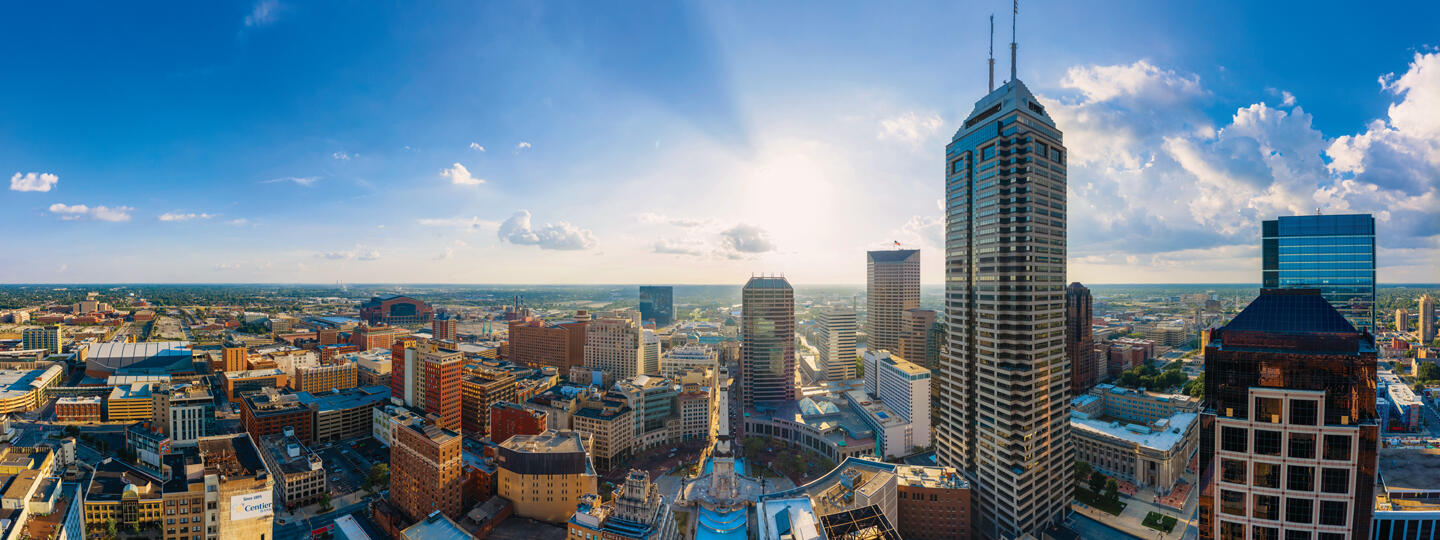 skyline of a city with office buildings and sky scrapers on a sunny day