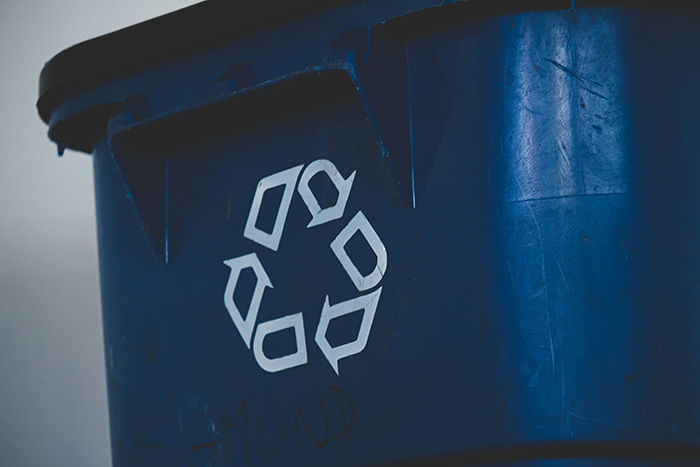 blue recycle bin with white recycle symbol